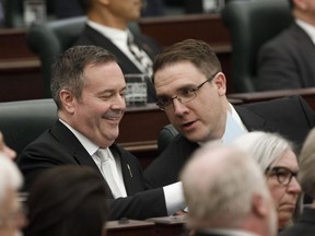 Alberta Premier Jason Kenny and Jason Nixon Minister of Environment and Parks chat before the speech from the throne is delivered in Edmonton on May 21, 2019. Albertans are expected to learn Monday how they can take up to 164 provincial parks and recreation sites off the hands of a government that no longer wants them. The move, announced in early March, comes despite concern from thousands of people, including parks users, businesses, rural municipalities and opposition politicians. Environment Minister Jason Nixon has announced the United Conservative government will fully or partially close 20 provincial parks and hand off another 164 to third-party managers. Sites for which no manager can be found will lose park status and revert to general Crown land, which can be sold.