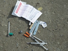Needles are seen on the ground in Oppenheimer park in Vancouver's downtown eastside on March 17, 2020. A rising death toll from overdoses in B.C. during the COVID-19 pandemic has advocates, government officials and health-care workers concerned about a public health emergency that has been overshadowed by the response to the virus. The BC Coroners Service says 113 people died in March of suspected illicit drug toxicity, the first time in a year that deaths from overdoses across B.C. exceeded 100.