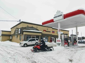 A gas station in St-Henri-de-Taillon, Que. is seen on Wednesday, January 22, 2020. A body found along the shoreline of Lac-St-Jean on Friday evening might be one of two remaining French snowmobilers listed as missing after their trip turned deadly as January.
