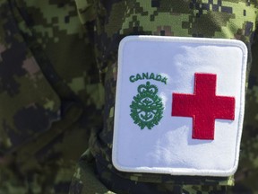 A patch is seen on a member of the Canadian Armed Forces at Residence Yvon-Brunet a long-term care home in Montreal, Saturday, April 18, 2020. The Canadian Forces say five members working in long-term care homes amid the COVID-19 pandemic have tested positive for the illness.