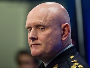 Vancouver Police Chief Adam Palmer pauses during a news conference in Vancouver, B.C., on Monday January 22, 2018. The union representing Vancouver's police officers joined the police chief Thursday in criticizing a budget cut passed by city council, arguing their services shouldn't be reduced during the COVID-19 pandemic.