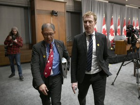Dr. Tom Wong, Chief Medical Officer of Public Health at Indigenous Services Canada, left, and Minister of Indigenous Services Marc Miller leave a press conference on COVID-19 in West Block on Parliament Hill in Ottawa, on Thursday, March 19, 2020. Federal officials say the next two weeks will be crucial in trying to determine the scope and severity of the spread of COVID-19 in First Nations communities.