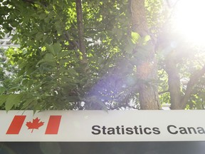 Statistics Canada building and signs are pictured in Ottawa on Wednesday, July 3, 2019. Statistics Canada is expected to report today that economic growth swung negative in March and the first quarter as a whole due to the COVID-19 pandemic.