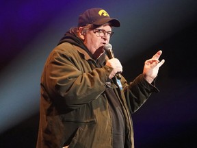 Director Michael Moore speaks during a rally by U.S. Democratic presidential candidate Senator Bernie Sanders in Cedar Rapids, Iowa, U.S., February 1, 2020.