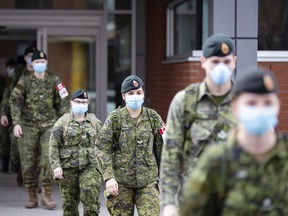 Canadian Armed Forces medical personnel leave following a shift at the Centre Valeo St. Lambert seniors' long-term care home in St. Lambert, Que., on April 24, 2020.