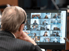 Canadian Members of Parliament are shown on a monitor during a virtual session of the House of Commons, April 28, 2020.