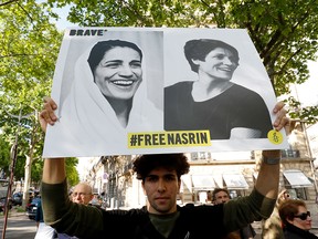 People gather outside the Iranian embassy in France on June 13, 2019, to support imprisoned Iranian human rights lawyer Nasrin Sotoudeh and to demand her release.