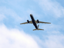 A Russian Air Force Tu-214 flies over Offutt Air Force Base, April 26, 2019, in Omaha, Neb. The flight is allowed as part of the Open Skies Treaty.