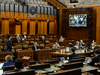 Prime Minister Justin Trudeau speaks and is projected onto large screens as he takes part in the COVID-19 Pandemic Committee in the House of Commons on May 27, 2020.