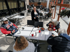 Customers on the patio at Smitty's restaurant in Winnipeg on May 4, 2020.