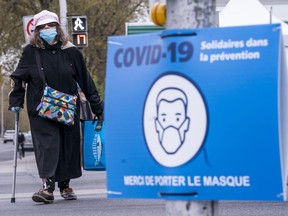 A sign asks Montrealers to voluntarily wear a protective mask in Montreal, on Friday, May 15, 2020.