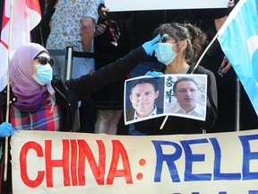 The B.C. Supreme Court is set to release a key decision in the Meng Wanzhou extradition case on Wednesday, May 27, 2020. Demonstrators are pictured Wednesday outside the B.C. Supreme Court as they await a judge's decision in United States v. Meng on the issue of double criminality.