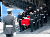 Masked military pallbearers carry the casket of Sub-Lt. Abbigail Cowbrough during a repatriation ceremony at CFB Trenton for the six Canadian Forces personnel killed in a helicopter crash off the coast of Greece, May 6, 2020.