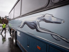 A Greyhound bus driver does a walk-around before moving the bus to a parking lot after arriving in Whistler, B.C., from Vancouver on Wednesday October 31, 2018. Greyhound Canada is temporarily slamming the brakes on all of its bussing routes and services as ridership plummets amid the COVID-19 pandemic.
