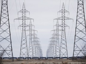 Manitoba Hydro power lines are photographed outside Winnipeg, Monday, May 1, 2018. Hundreds of Manitoba Hydro employees will be receiving layoff notices after the province directed the Crown utility to save costs during the economic downturn caused by the COVID-19 pandemic.