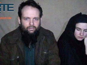 This undated militant image from video which has not been independently verified by The Associated Press, provided by SITE Intel Group, shows Canadian Joshua Boyle and American Caitlan Coleman, who were kidnapped in Afghanistan in 2012. The U.S. Federal Bureau of Investigation is offering a reward of up to US$1 million for information directly leading to the arrest or prosecution of those responsible for the abduction of Caitlan Coleman and spouse Joshua Boyle. THE CANADIAN PRESS/HOSITE Intel Group via AP)
