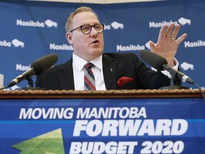 Manitoba Finance Minister Scott Fielding speaks to media at a press conference before the provincial budget is read at the Manitoba Legislature in Winnipeg, Wednesday, March 11, 2020. The Manitoba government says its plan to temporarily cut non-essential jobs in some areas by up to 30 per cent will work out to a much smaller number -- 2.2 per cent -- overall.