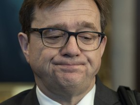 Minister of Environment and Climate Change Jonathan Wilkinson speaks with the media following a cabinet meeting in Ottawa, Tuesday, February 4, 2020. Environment Canada is doing fewer inspections, investigations and prosecutions to enforce its law protecting people from toxic chemicals and air pollution.