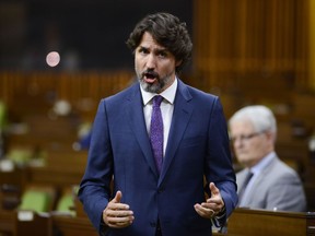 Prime Minister Justin Trudeau stands during question period in the House of Commons on Parliament Hill amid the COVID-19 pandemic in Ottawa on Monday, May 25, 2020.