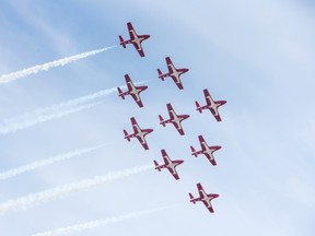 The Canadian Forces Snowbirds fly in the team’s signature nine-jet formation, with trailing white smoke, over Fredericton, on Sunday,May 3, 2020. They flew over the city as part of Operation Inspiration which will see them fly over cities across the country starting in New Brunswick and Nova Scotia today and working west throughout the week.