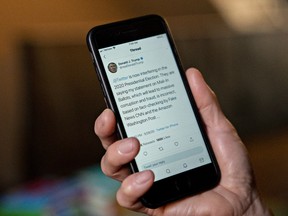 A Twitter election interference tweet by U.S. President Donald Trump is displayed on a smartphone in an arranged photograph taken in Arlington, Virginia, U.S., on Wednesday, May 26, 2020.