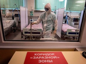 A medical worker wearing protective equipment is seen at an intensive care unit of a new hospital built to treat coronavirus patients outside the village of Golokhvastovo on April 23, 2020.