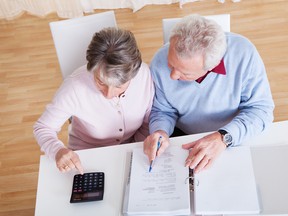 Senior Couple Calculating Budget