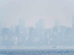 The Vancouver skyline is seen under heavy haze from Jericho Beach in August 2018.