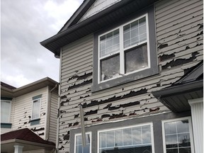 Hail damage shown on a home in Calgary's northeast Taradale neighbourhood, after a storm moved through the area on Saturday, June 13, 2020, leaving siding on homes shredded, car windshields smashed and windows broken. Khalid Mahmood/Postmedia