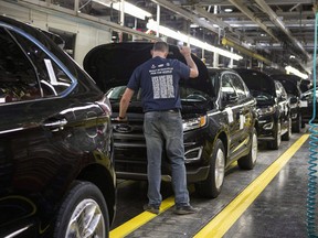 Ford Edges seen on a production line the Ford Motor Company assembly plant in Oakville, Ont., on Thursday, February 26, 2015.