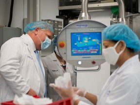 Ontario Premier Doug Ford visits Canadian Hospital Specialities (CHS) helping them take dual COVID-19 testing swab kits and separating them into two units to help with swab capacity during the COVID-19 pandemic in Oakville, Ont., on Monday, June 8, 2020.