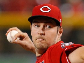 In this Sept. 15, 2019, file photo, Cincinnati Reds pitcher Trevor Bauer throws to an Arizona Diamondbacks batter during the first inning of a baseball game in Phoenix.