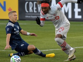 Mar 7, 2020: Toronto FC forward Ifunanyachi Achara (99) dribbles the ball away from New York City defender Anton Tinnerholm (3) in the first half at BMO Field.