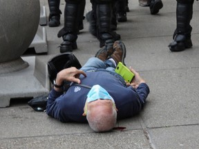 Martin Gugino, a 75-year-old protester, seen on the ground after he was shoved by two Buffalo, New York, police officers during a protest against the death in Minneapolis police custody of George Floyd in Niagara Square in Buffalo, New York, U.S., June 4, 2020.