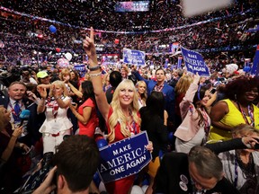 Delegates stand and cheer at the end of the Republican National Convention on July 21, 2016 at the Quicken Loans Arena in Cleveland, Ohio.