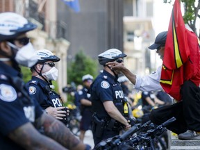 A protestor confronts a Toronto Police officer during an anti-racism march on June 6, 2020 in Toronto.