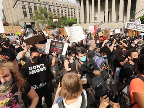 Hundreds of protesters gather in Manhattan's Foley Square to protest the recent death of George Floyd, a Black man who was killed after a police officer was filmed kneeling on his neck in Minneapolis on May 30, 2020 in New York City.