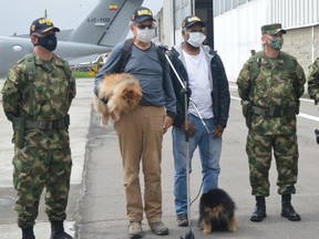 Daniel Guggenheim of Switzerland and Jose Alburqueque of Brazil speak to the media during a news conference at a military base in Bogota, after Colombian forces rescued them following their kidnapping in Cauca region by dissidents of the Revolutionary Armed Forces of Colombia (FARC), in Bogota, Colombia June 18, 2020.