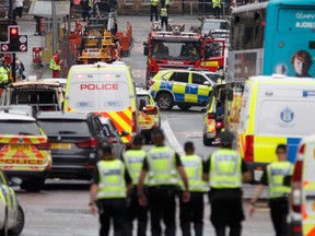 Police and emergency services respond at the scene of a fatal stabbing incident at the Park Inn Hotel in central Glasgow on June 26, 2020.