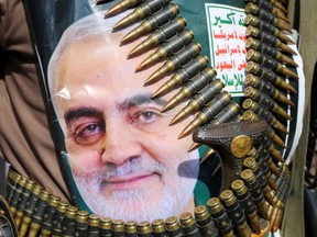 A supporter of the Houthis has a poster attached to his waist of Iranian Major-General Qassem Soleimani, head of the elite Quds Force, who was killed in an air strike at Baghdad airport, during a rally to denounce the U.S. killing, in Saada, Yemen January 6, 2020.