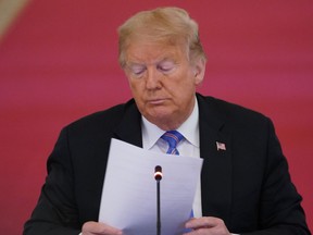 In this file photo taken on June 26, 2020 U.S. President Donald Trump looks on during an American Workforce Policy Advisory Board Meeting in the East Room of the White House in Washington, D.C.