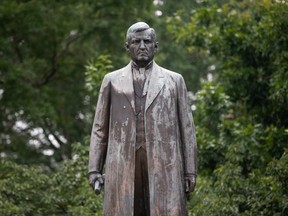 A statue of Ben (Pitchfork) Tillman looks over the statehouse in Columbia, S.C., on June 6.