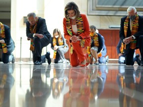 Sen. Cory Booker (D-NJ), Senate Minority Leader Charles Schumer (D-NY), Sen. Kamala Harris (D-CA), Speaker of the House Nancy Pelosi (D-CA), Rep. Karen Bass (D-CA) and House Majority Leader Steny Hoyer (D-MD) join fellow Democrats from the House and Senate kneel in silence for eight minutes and 46 seconds to honour George Floyd in the U.S. Capitol Visitors Center June 08, 2020 in Washington, DC.