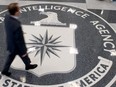 A man crosses the Central Intelligence Agency (CIA) logo in the lobby of CIA Headquarters in Langley, Virginia, in this August 14, 2008 file photo.