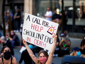 A demonstrator takes part in an "Abolish the police" sit-in in Toronto, on June 19, 2020.