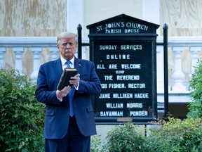 U.S. President Donald Trump holds a Bible while visiting St. John's Church across from the White House after the area was cleared of people protesting the death of George Floyd June 1, 2020, in Washington, DC.