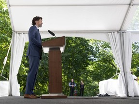 Prime Minister Justin Trudeau responds to a question from the media during a new conference outside Rideau Cottage in Ottawa, Monday June 8, 2020. Trudeau says he'll propose equipping police with body-worn cameras to the country's premiers this week, hoping for rapid movement.