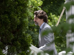 Prime Minister Justin Trudeau walks up the front stairs of Ridea Cottage following a news conference in Ottawa, Thursday June 4, 2020.