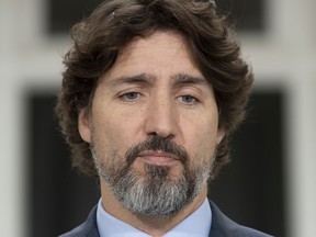 Prime Minister Justin Trudeau is seen as he pauses during a response to a question on racism during a news conference outside Rideau Cottage in Ottawa on Tuesday June 2, 2020. As long-standing anger about discrimination boils over in the United States, Prime Minister Justin Trudeau says Canadians must recognize there is systemic racism in their own country.