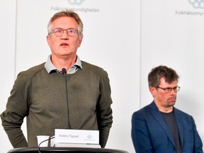 State epidemiologist Anders Tegnell (L) of the Public Health Agency of Sweden speaks during a news conference on a daily update on the coronavirus Covid-19 situation, in Stockholm, Sweden, on June 3, 2020.
